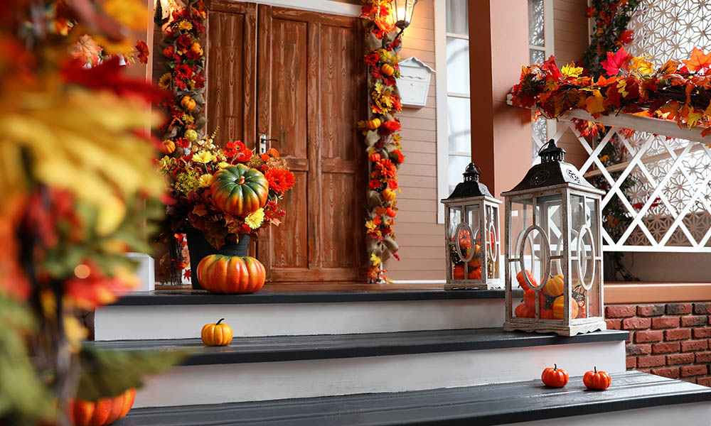 Blog - House Entrance Decorated with Pumpkins and Fall Leaves For Halloween